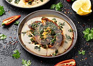 Cauliflower steaks with chimichurri sauce and butter bean puree