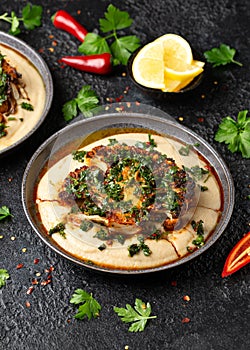 Cauliflower steaks with chimichurri sauce and butter bean puree