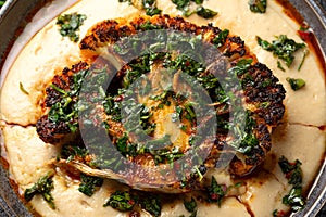 Cauliflower steaks with chimichurri sauce and butter bean puree