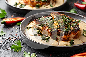 Cauliflower steaks with chimichurri sauce and butter bean puree