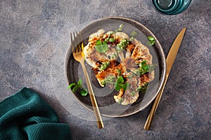 Cauliflower steaks with herb sauce and spice. plant based meat substitute