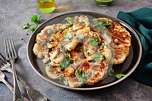 Cauliflower steaks with herb sauce and spice. plant based meat substitute