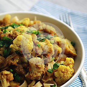 Cauliflower stew with curry. Vegetarian cuisine.