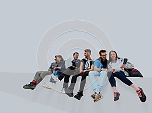 Causal group of people sitting on the floor isolated.