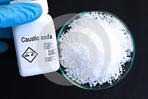 caustic soda in bottle , chemical in the laboratory and industry