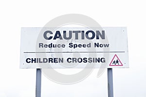 Caution children crossing road safety sign sky