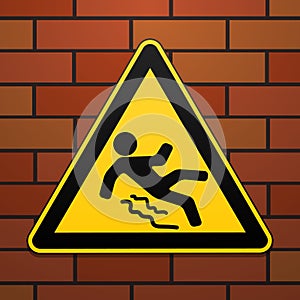 Caution - danger Beware of slippery. Safety sign. The triangular sign on a brick wall. Industrial design. Vector