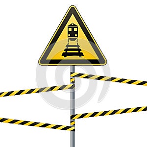 Caution - danger Warning sign safety. Beware of the train. A yellow triangle with a black image. The sign on the pole and protecti