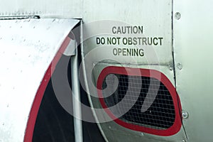 Caution do not obstruct opening decal on an old aircraft