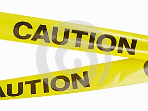 Caution - inscription on yellow plastic tape. Limitation of space, border, fence under construction and collapsing buildings,