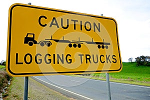 Caution Logging Trucks signage on a country road, Australia.