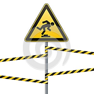 Caution, low-noticeable obstacle. Safety sign. Yellow triangle with black image on the pole and protecting ribbons