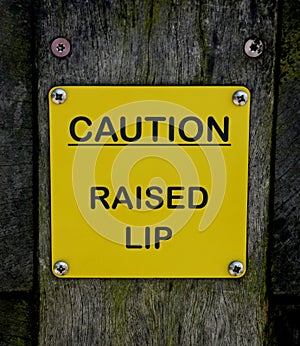 Caution Raised Lip Sign at a Canal Lock Gate