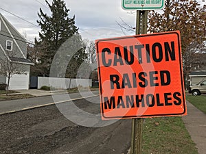 Caution Raised Manholes, Road Construction Sign