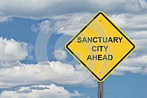 Caution Sign Blue Sky - Sanctuary City Ahead photo