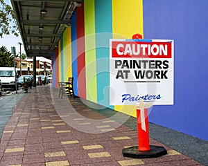 Painters at work caution sign