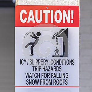 Caution sign on a snowy area in winter