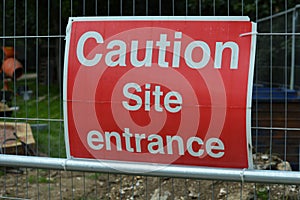 Caution site entrance sign.