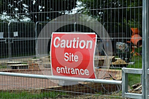Caution site entrance sign.