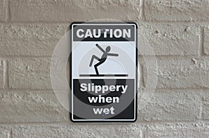 Caution slippery when wet sign