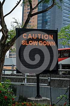 Caution slowdown. Traffic information sign