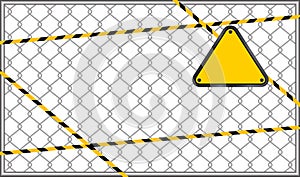 Caution tape line stripe on wire mesh and triangle warning sign, triangle sign yellow on wire mesh isolated on white background,