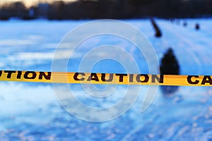 Caution or warning sign of drowning, frozen lake