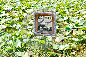 Caution warning sign in Florida Everglades National park, USA