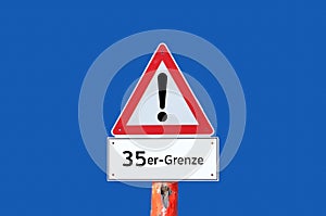 Caution warning sign 35 limit on blue background in german photo