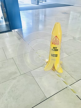Caution wet floor sign that looks like a banana peel.