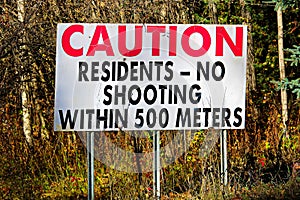 A Cautions Residents, No Shooting Within 500 Meters sign
