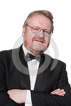 Cautious man in tuxedo on white photo