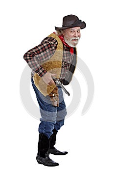 Cautious old cowboy ready with his gun
