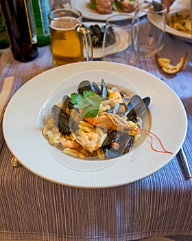 Cavaletti Pasta With Seafood and Mussels Served In A Traditional Italian Restaurant