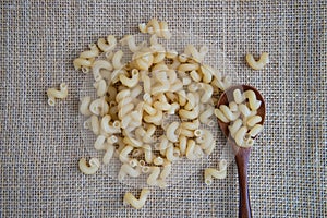 Cavatappi raw pasta on rustic background . Natural and healthy food concept.