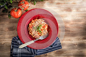 Cavatelli pasta with fresh tomato sauce. photo