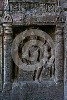 Cave 19 : Left wing of faÃ§ade showing Nagaraja snake king and his consort nagini. Ajanta Caves, Aurangabad, Maharashtr