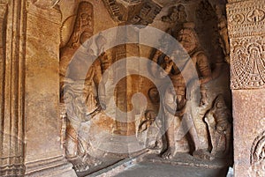 Cave 3 : Carved figure of Vishnu as Narasimha, half human, half lion, on the right and Harihara, a syncretic sculpture of Vishnu a