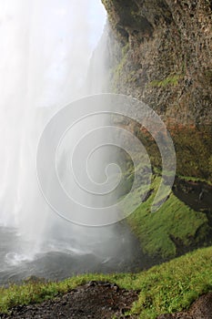 A cave behind the waterfall in Iceland - Seljalandsfoss