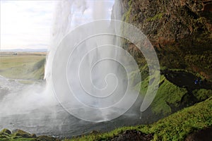 A cave behind the waterfall in Iceland - Seljalandsfoss