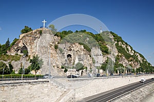 Cave church, cross and statue of Liberty on the Gellert Hill in