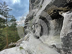 Cave for climbers. Climbers around and at the Falkenstein in Sax