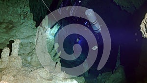 Cave diving underwater in Yucatan Mexico cenotes.