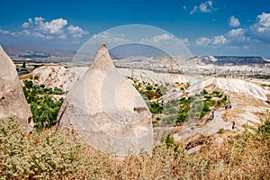 Cave dwelling on turkish natural landscape background