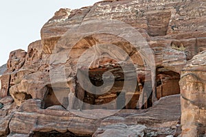 The cave Dwellings in the sandstone rock in the ancient city of Petra, Jordan.