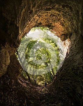 Cave entrance with man