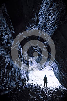Cave entrance with man