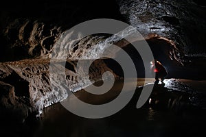 Cave explorer, spelunker, archeologist stuydying underground passage