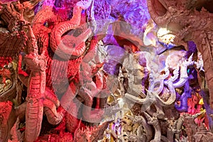 A cave full of mythical animal art called Naga