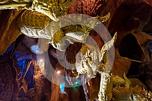 A cave full of mythical animal art called Naga